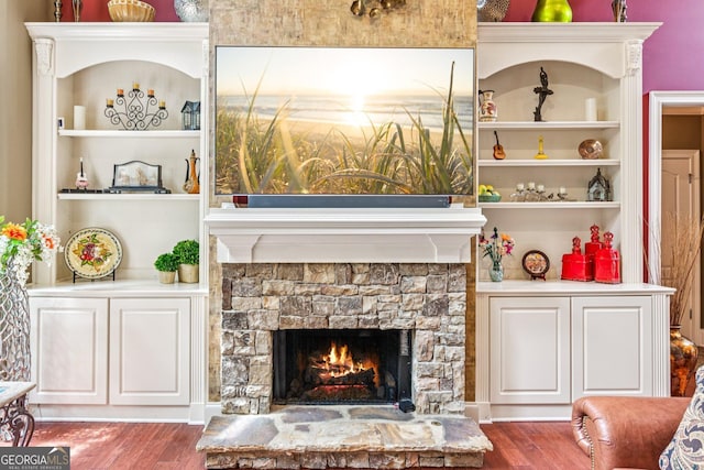 5717 Meadow View Dr, Jefferson, GA 30549 - detailed view of wood finished floors, a fireplace, and built in shelves