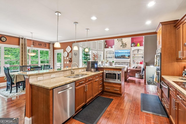 5717 Meadow View Dr, Jefferson, GA 30549 - kitchen with appliances with stainless steel finishes, brown cabinets, a warming drawer, dark wood-type flooring, and light stone counters