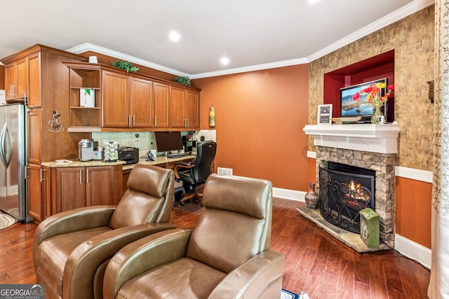 5717 Meadow View Dr, Jefferson, GA 30549 - home office featuring built in study area, dark wood-style floors, crown molding, a fireplace, and recessed lighting