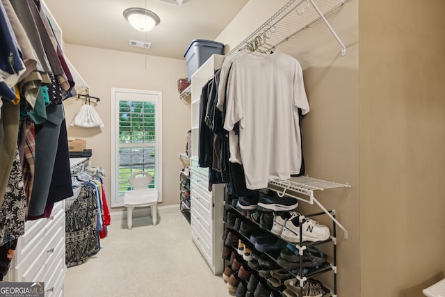 5717 Meadow View Dr, Jefferson, GA 30549 - walk in closet featuring attic access and light carpet