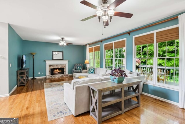 878 Treadstone Overlook, Suwanee, GA 30024 - living room with a ceiling fan, wood finished floors, and a fireplace