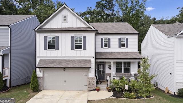 545 Quail Pass, Dawsonville, GA 30534 - view of front of home featuring board and batten siding, a porch, a shingled roof, and driveway