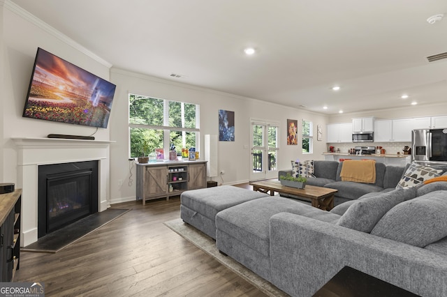 545 Quail Pass, Dawsonville, GA 30534 - living room featuring ornamental molding, recessed lighting, dark wood finished floors, and a glass covered fireplace