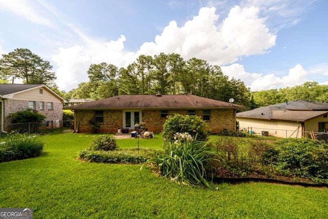 1472 High Meadow Dr, Stone Mountain, GA 30083 - back of property featuring brick siding and french doors