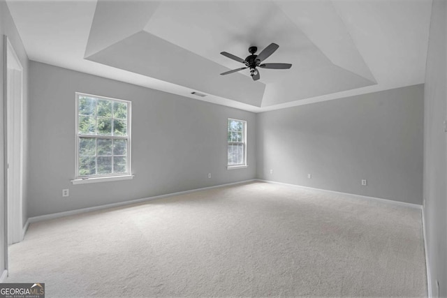 1455 Holleybrooke Dr, Alpharetta, GA 30004 - spare room featuring a raised ceiling, ceiling fan, and carpet flooring