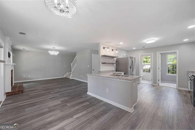 1455 Holleybrooke Dr, Alpharetta, GA 30004 - kitchen with a chandelier, appliances with stainless steel finishes, dark wood-type flooring, recessed lighting, and white cabinets