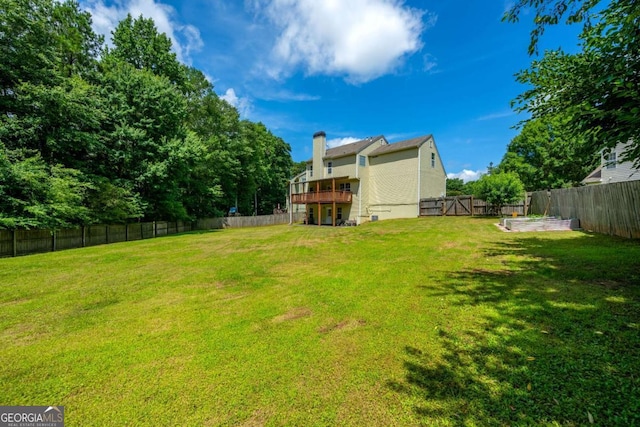 1455 Holleybrooke Dr, Alpharetta, GA 30004 - fenced backyard with a deck and a vegetable garden