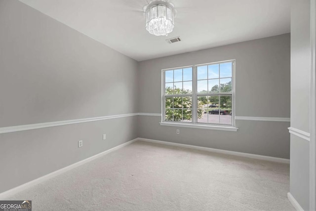 1455 Holleybrooke Dr, Alpharetta, GA 30004 - carpeted spare room featuring a chandelier and baseboards