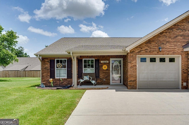 2204 Applebrook Dr, Rossville, GA 30741 - view of front of house with driveway, brick siding, roof with shingles, a front yard, and an attached garage