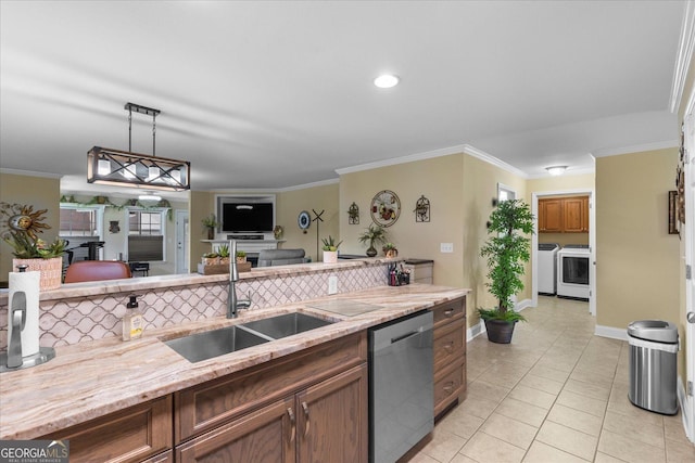 2204 Applebrook Dr, Rossville, GA 30741 - kitchen featuring stainless steel dishwasher, washing machine and dryer, light tile patterned floors, light stone counters, and pendant lighting