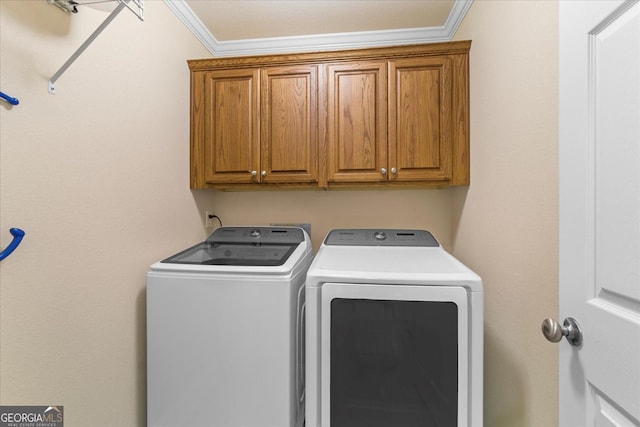 2204 Applebrook Dr, Rossville, GA 30741 - laundry room featuring washing machine and dryer, cabinet space, and ornamental molding