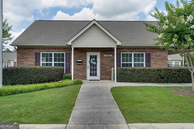 2204 Applebrook Dr, Rossville, GA 30741 - view of front of house with brick siding, a front yard, and a shingled roof