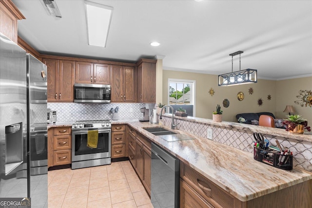 2204 Applebrook Dr, Rossville, GA 30741 - kitchen featuring appliances with stainless steel finishes, a peninsula, tasteful backsplash, crown molding, and light stone countertops