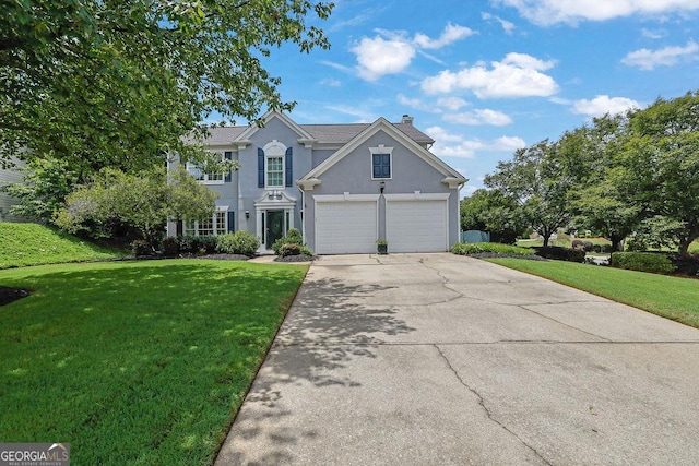 7325 Brookwood Way, Cumming, GA 30041 - traditional-style home with a chimney, concrete driveway, a front lawn, and stucco siding