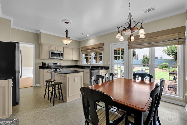 7325 Brookwood Way, Cumming, GA 30041 - dining space featuring a chandelier and crown molding