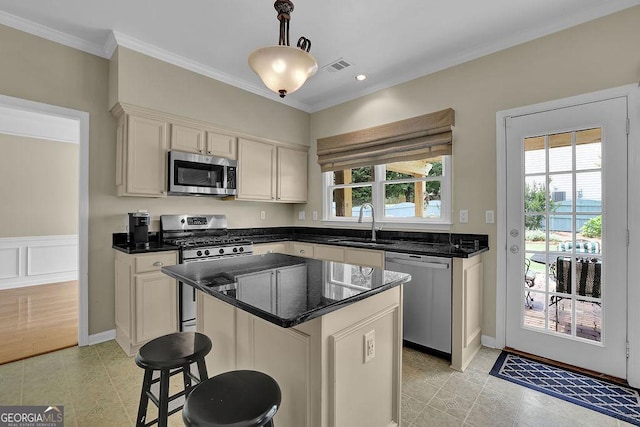 7325 Brookwood Way, Cumming, GA 30041 - kitchen featuring stainless steel appliances, plenty of natural light, crown molding, a kitchen island, and pendant lighting