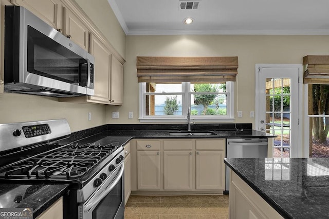 7325 Brookwood Way, Cumming, GA 30041 - kitchen with appliances with stainless steel finishes, light tile patterned floors, ornamental molding, dark stone countertops, and recessed lighting