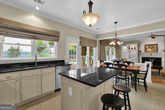 7325 Brookwood Way, Cumming, GA 30041 - kitchen with stainless steel dishwasher, ornamental molding, a chandelier, hanging light fixtures, and a breakfast bar area