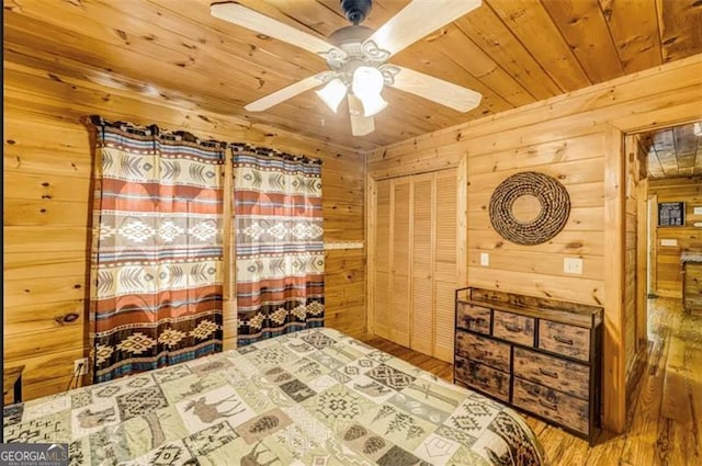 9947 Doublehead Gap Rd, Blue Ridge, GA 30513 - unfurnished bedroom featuring wooden ceiling, wood walls, wood finished floors, and a ceiling fan