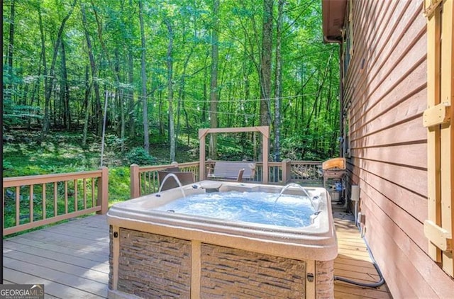 9947 Doublehead Gap Rd, Blue Ridge, GA 30513 - deck with a hot tub and a wooded view