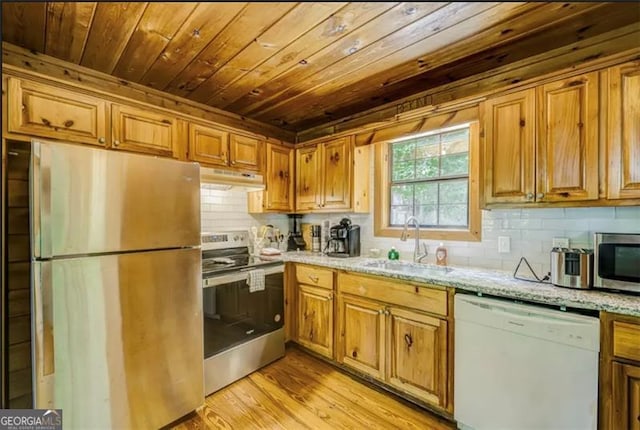 9947 Doublehead Gap Rd, Blue Ridge, GA 30513 - kitchen with appliances with stainless steel finishes, under cabinet range hood, wood ceiling, tasteful backsplash, and light stone counters
