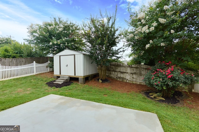 67 Granite Ct, Dallas, GA 30132 - fenced backyard featuring a patio and a storage shed