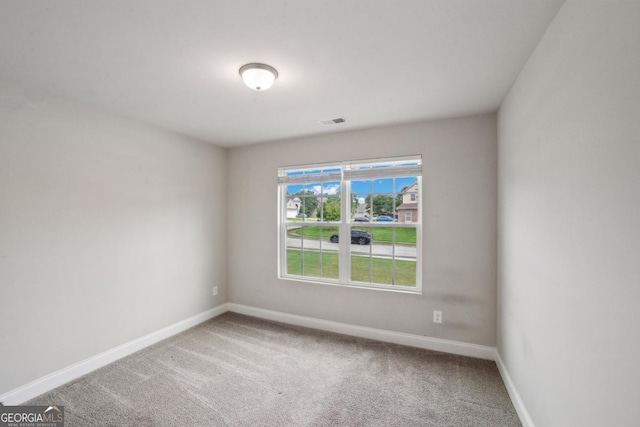 176 Windy Cir, Mcdonough, GA 30253 - carpeted spare room featuring baseboards