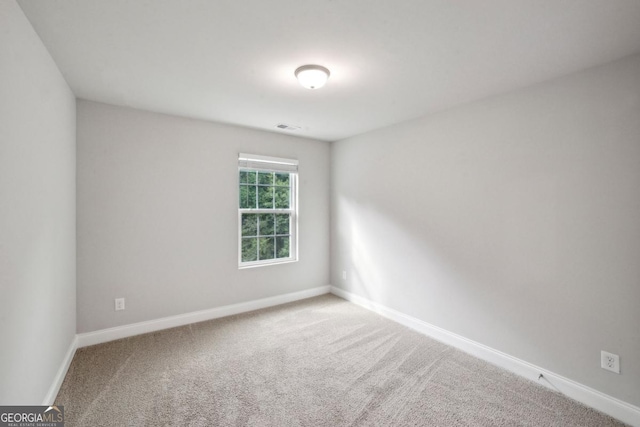 176 Windy Cir, Mcdonough, GA 30253 - spare room featuring baseboards and carpet