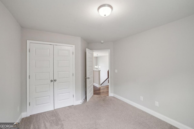 176 Windy Cir, Mcdonough, GA 30253 - unfurnished bedroom with carpet floors and a closet