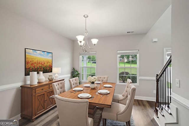 176 Windy Cir, Mcdonough, GA 30253 - dining room with wood finished floors and a chandelier