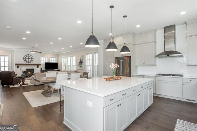 385 Rowes Cir, Alpharetta, GA 30009 - kitchen featuring high end fridge, wall chimney exhaust hood, black cooktop, ceiling fan, and dark wood finished floors