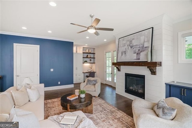 385 Rowes Cir, Alpharetta, GA 30009 - living room with ceiling fan, wood finished floors, ornamental molding, a large fireplace, and recessed lighting