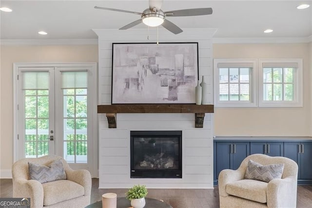 385 Rowes Cir, Alpharetta, GA 30009 - living area featuring crown molding, wood finished floors, ceiling fan, a fireplace, and recessed lighting