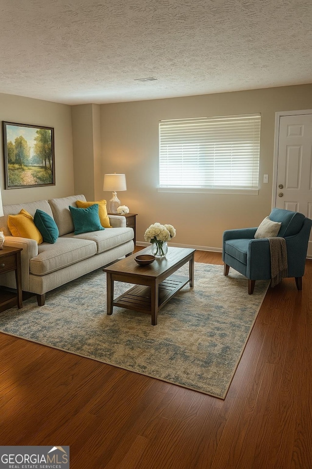 5581 Marbut Rd, Lithonia, GA 30058 - living room with a textured ceiling and wood finished floors