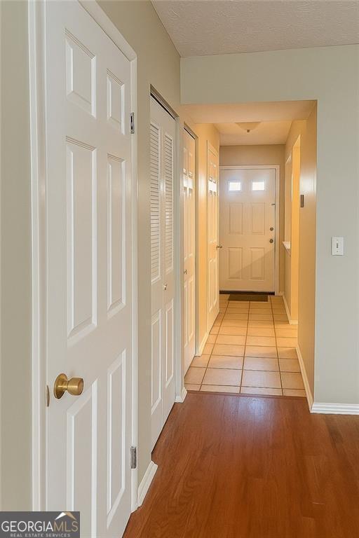 5581 Marbut Rd, Lithonia, GA 30058 - corridor with wood finished floors and baseboards