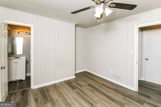 1947 Main St NW, Atlanta, GA 30318 - spare room featuring ceiling fan, dark wood-style floors, and wooden walls