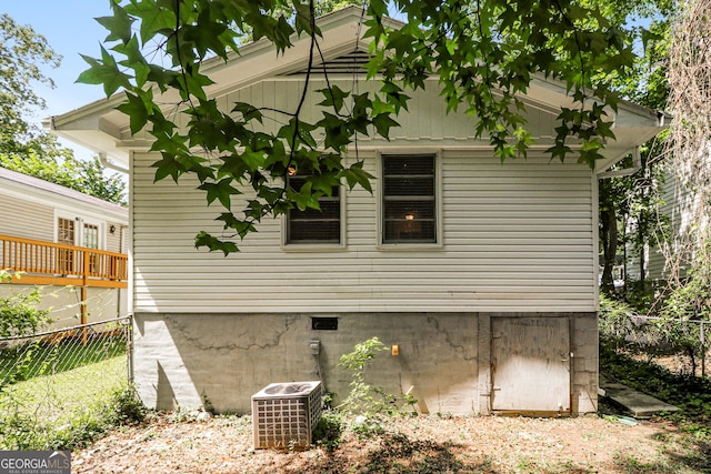 1947 Main St NW, Atlanta, GA 30318 - view of side of home featuring a central AC unit and crawl space