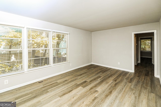 1947 Main St NW, Atlanta, GA 30318 - spare room featuring wood finished floors and baseboards