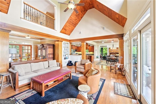 44 Sassafras Rdg, Big Canoe, GA 30143 - living area featuring a ceiling fan, wood finished floors, plenty of natural light, high vaulted ceiling, and beamed ceiling