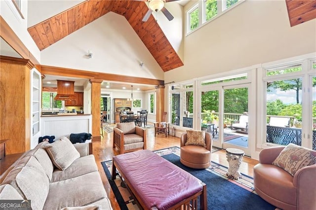 44 Sassafras Rdg, Big Canoe, GA 30143 - living room featuring high vaulted ceiling, a ceiling fan, wood finished floors, ornate columns, and wood ceiling