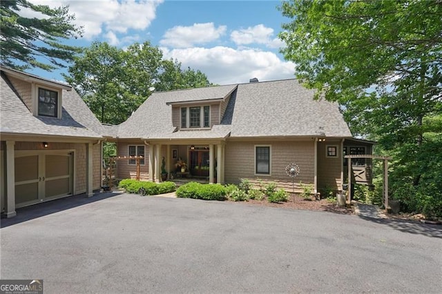 44 Sassafras Rdg, Big Canoe, GA 30143 - view of front of house featuring asphalt driveway and a shingled roof