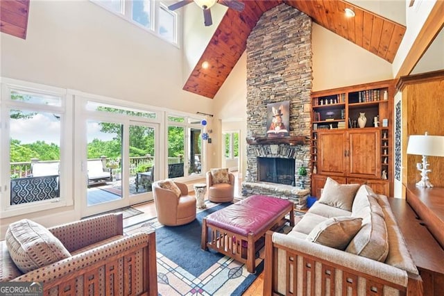 44 Sassafras Rdg, Big Canoe, GA 30143 - living area with high vaulted ceiling, a fireplace, ceiling fan, and wood finished floors