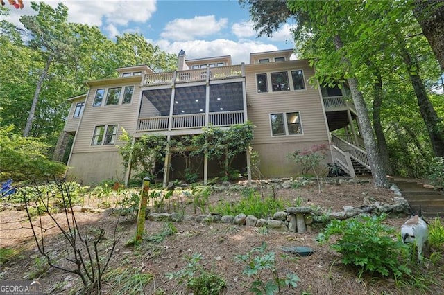 44 Sassafras Rdg, Big Canoe, GA 30143 - rear view of property featuring stairway, a sunroom, and a chimney