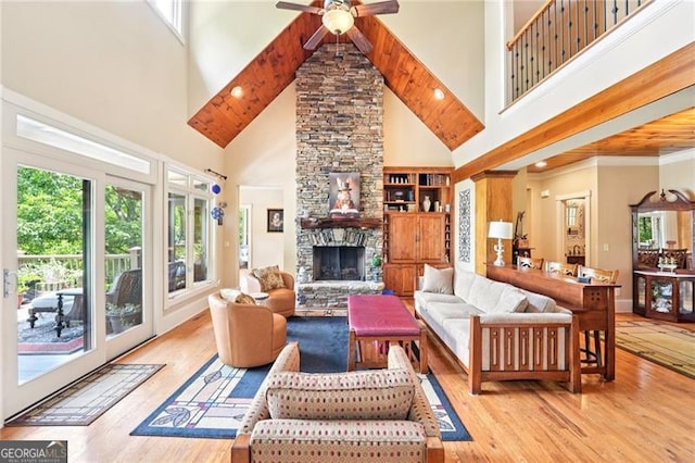44 Sassafras Rdg, Big Canoe, GA 30143 - living area featuring a towering ceiling, wood finished floors, a stone fireplace, ceiling fan, and recessed lighting