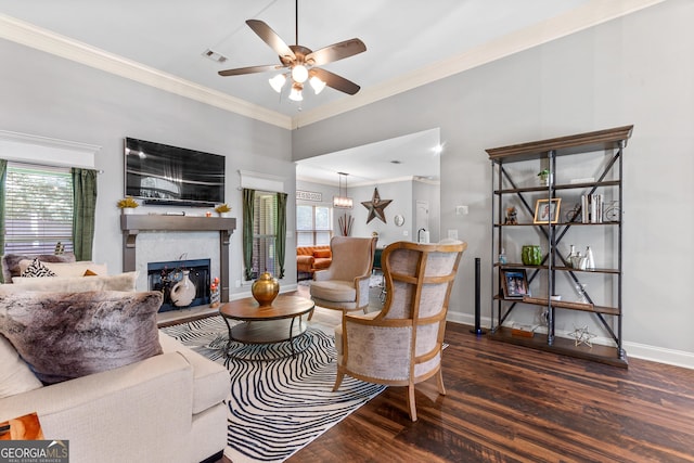 300 Bridgehampton Way, Perry, GA 31069 - living area with wood finished floors, ceiling fan, healthy amount of natural light, a fireplace, and ornamental molding