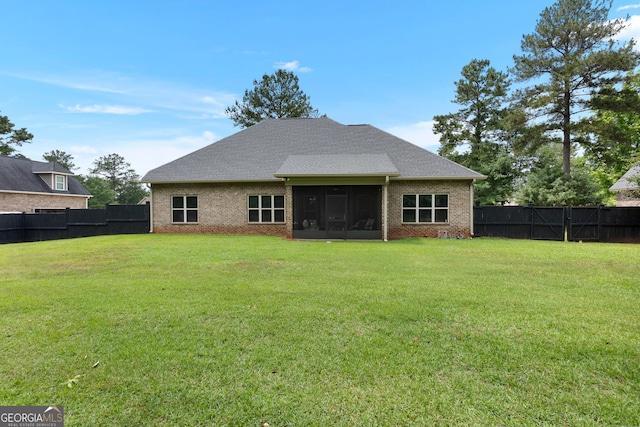 300 Bridgehampton Way, Perry, GA 31069 - back of property with a sunroom, a fenced backyard, and brick siding