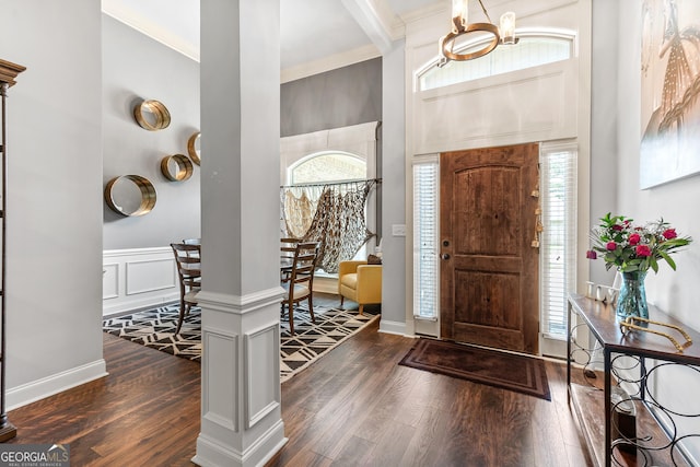 300 Bridgehampton Way, Perry, GA 31069 - foyer entrance with a chandelier, dark wood-style floors, crown molding, plenty of natural light, and a towering ceiling