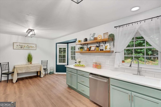 425 Shelby Ln, Hiram, GA 30141 - kitchen featuring stainless steel dishwasher, green cabinets, decorative backsplash, and light countertops
