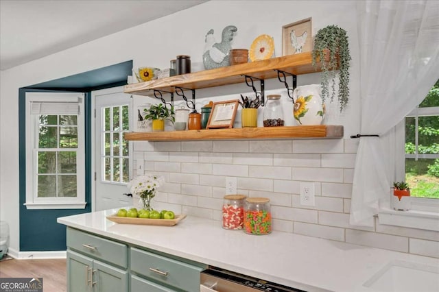 425 Shelby Ln, Hiram, GA 30141 - kitchen featuring open shelves, green cabinetry, tasteful backsplash, and light countertops