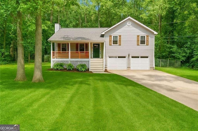 425 Shelby Ln, Hiram, GA 30141 - tri-level home with covered porch, a chimney, concrete driveway, and an attached garage